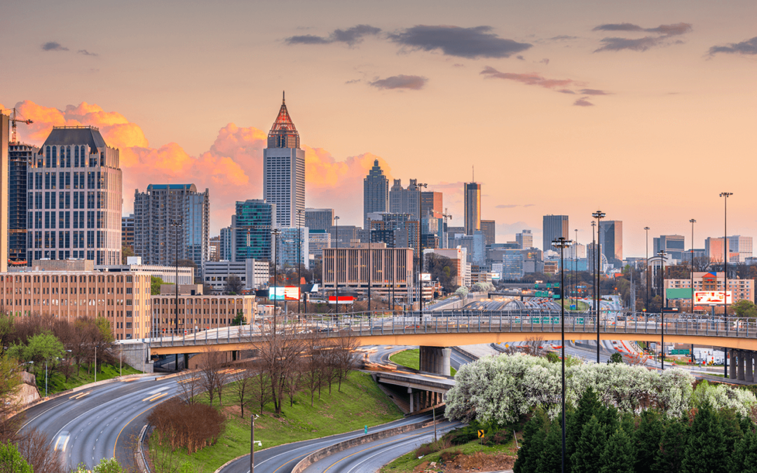 Atlanta city skyline at sunset with view of highways and skyscrapers.