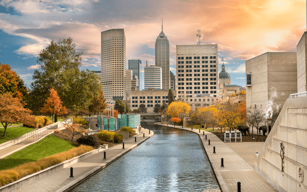 Skyline of downtown Indianapolis along the Central Canal on a fall day.