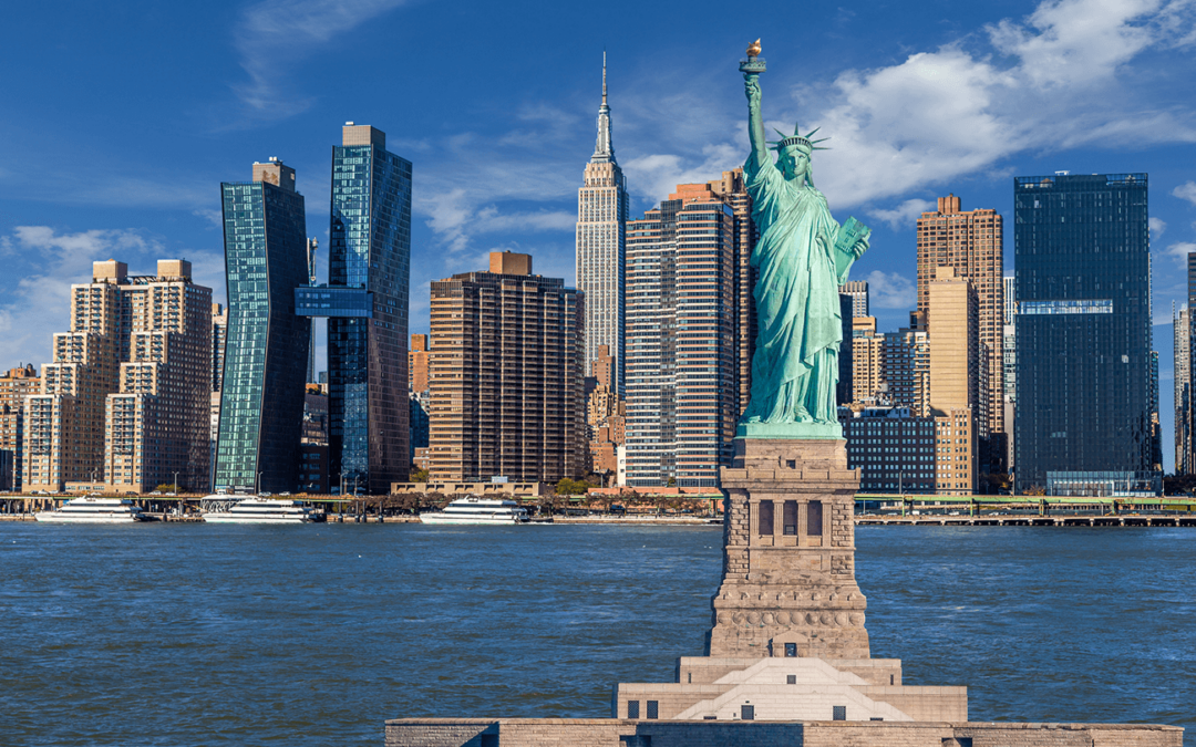 Statue of Liberty with New York City skyline in the background.