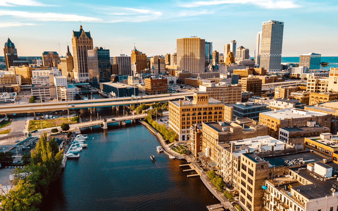 Aerial view of downtown Milwaukee with a river running through the city.