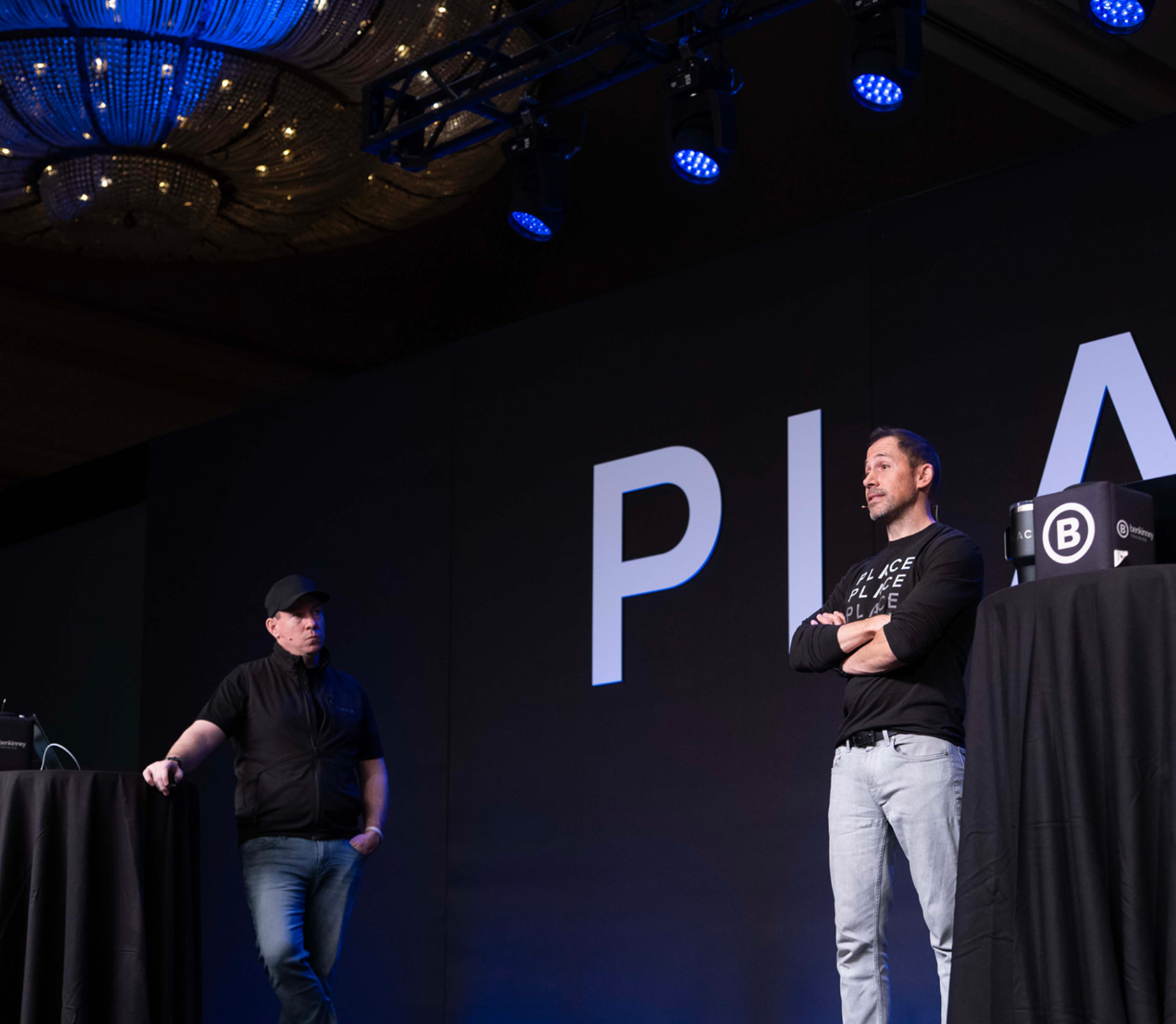 business woman sitting in front of building smiling